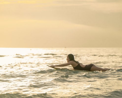surfer on a board waiting for a wave