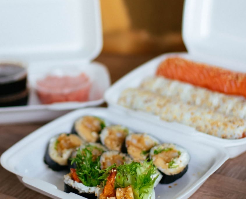 sushi in a take out box