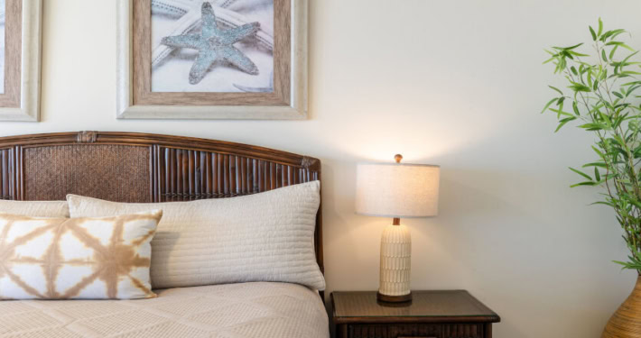 Bed with side lamp, wall decoration
