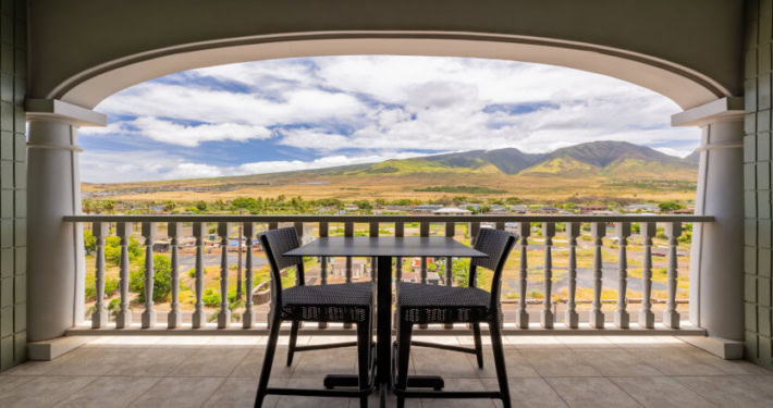 private lanai with views of the west Maui mountains and seating